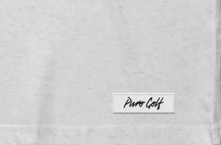 Label with 'Puma Golf' on left hem